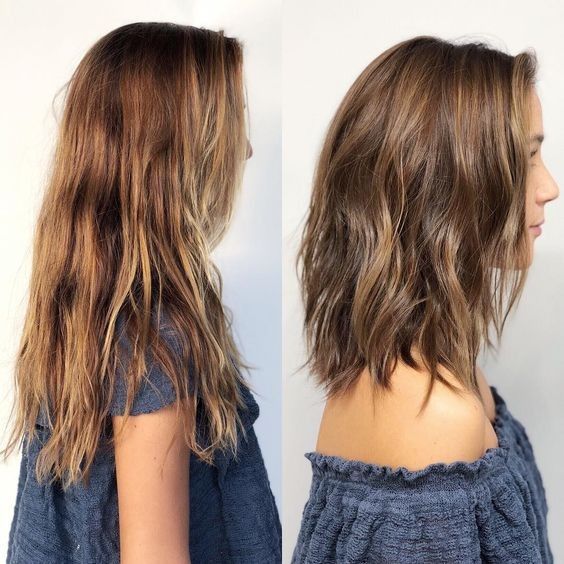 Wavy lob haircut hitting just above the collarbone with soft S-waves